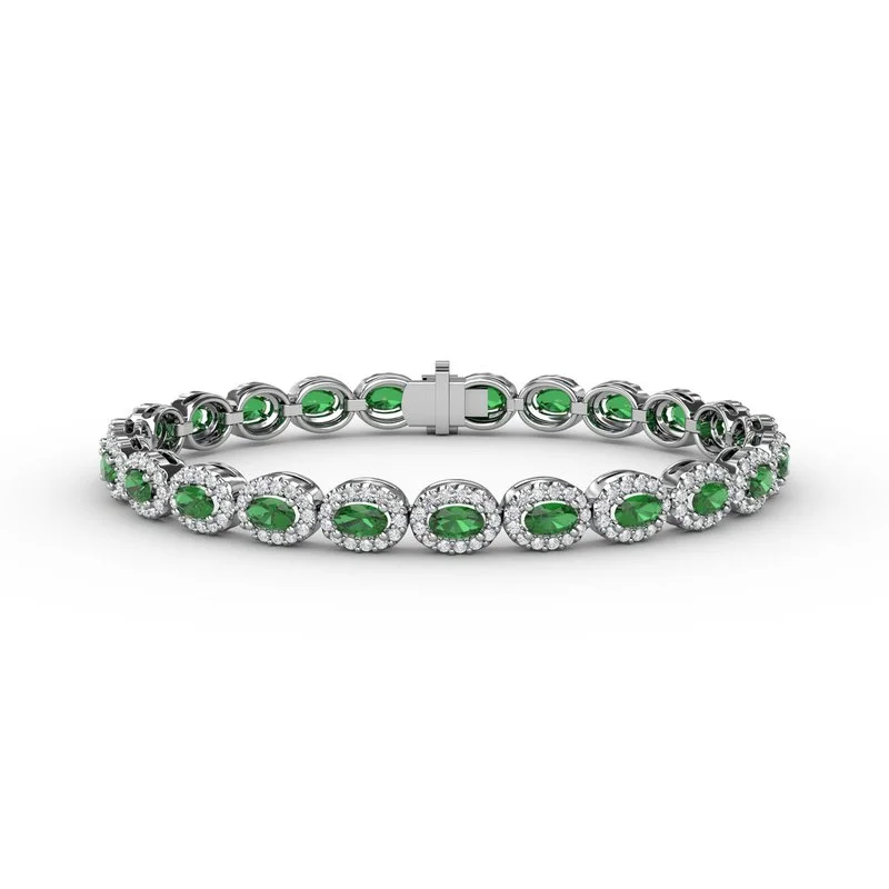 Ladies Bracelets with Blue Topaz-Striking Oval Emerald and Diamond Bracelet B1161E